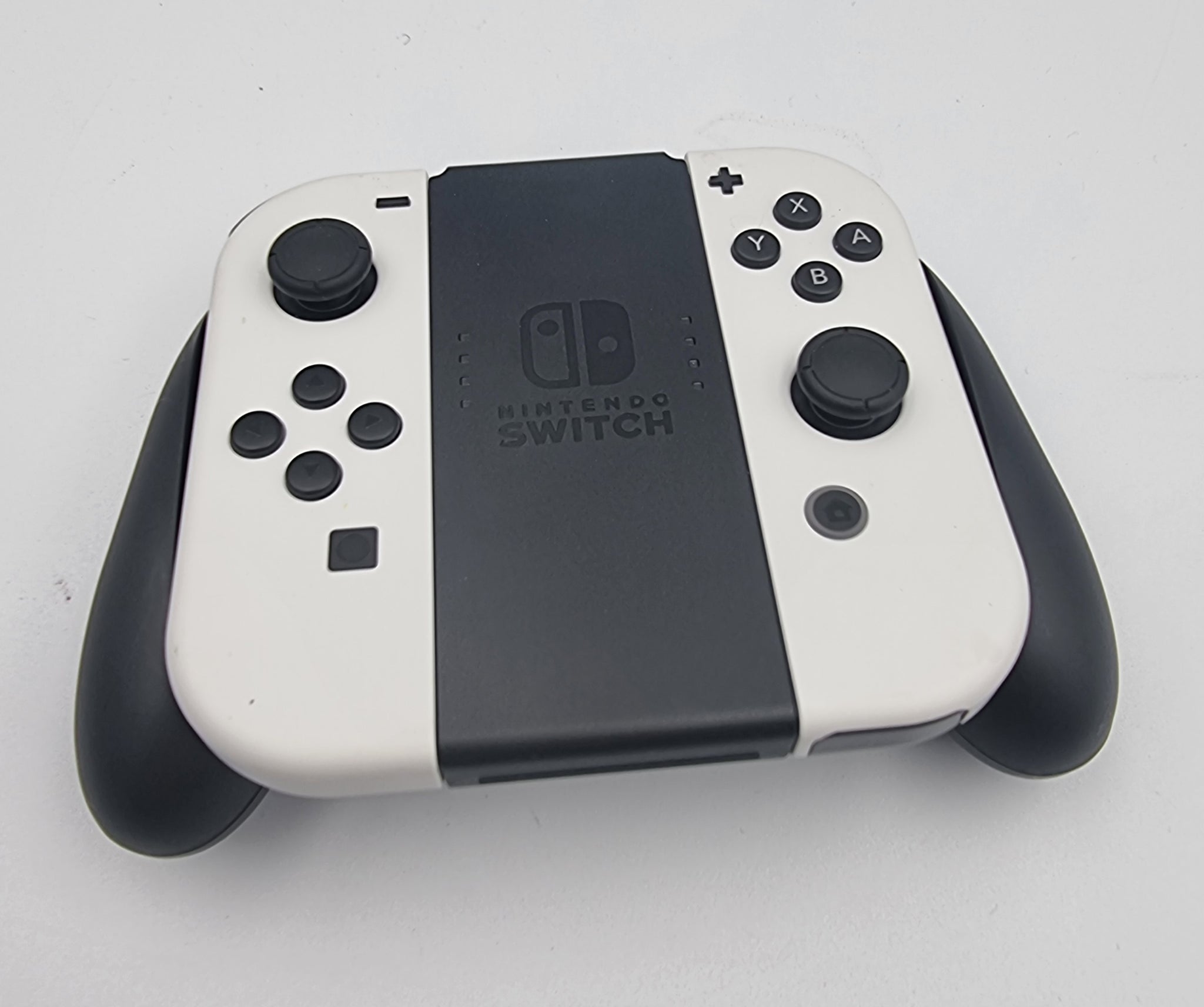 Nintendo Switch OLED 64GB white/black handheld console with hdmi dock. Original charger and joy-con cradle. Comes with carry case
