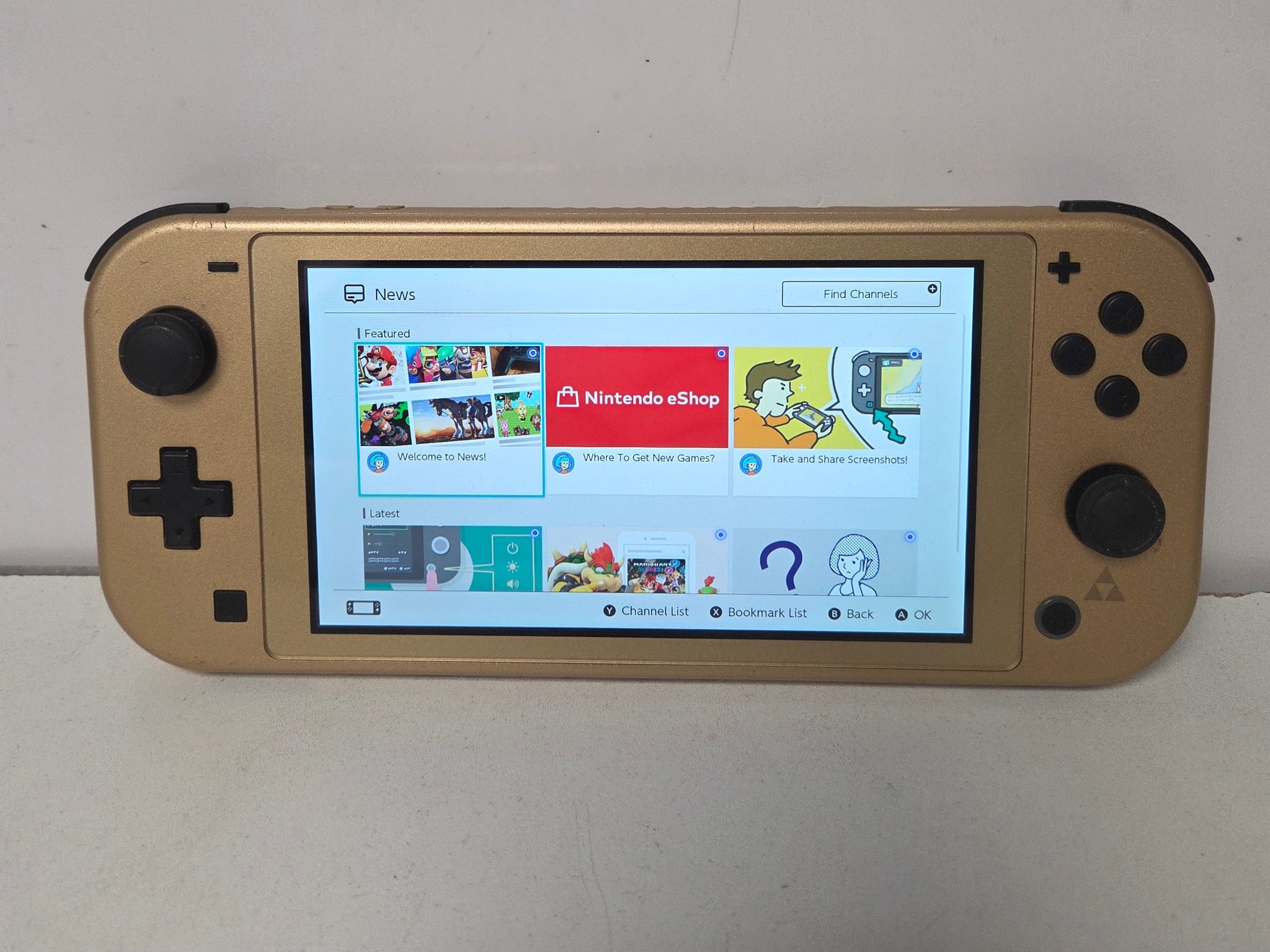 Nintendo Switch Lite  - Gold Hyrule Edition with Zelda Links Awakening Game & Accesories set