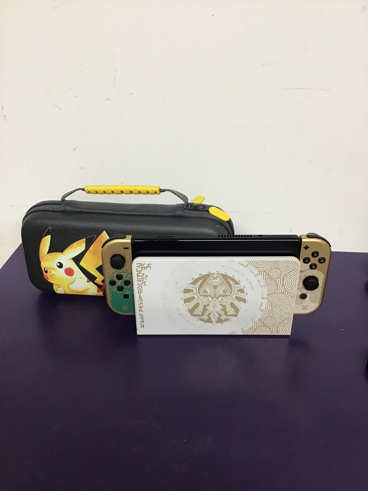 Nintendo Switch OLED - Tears of the kingdom edition with Pikachu hard case.