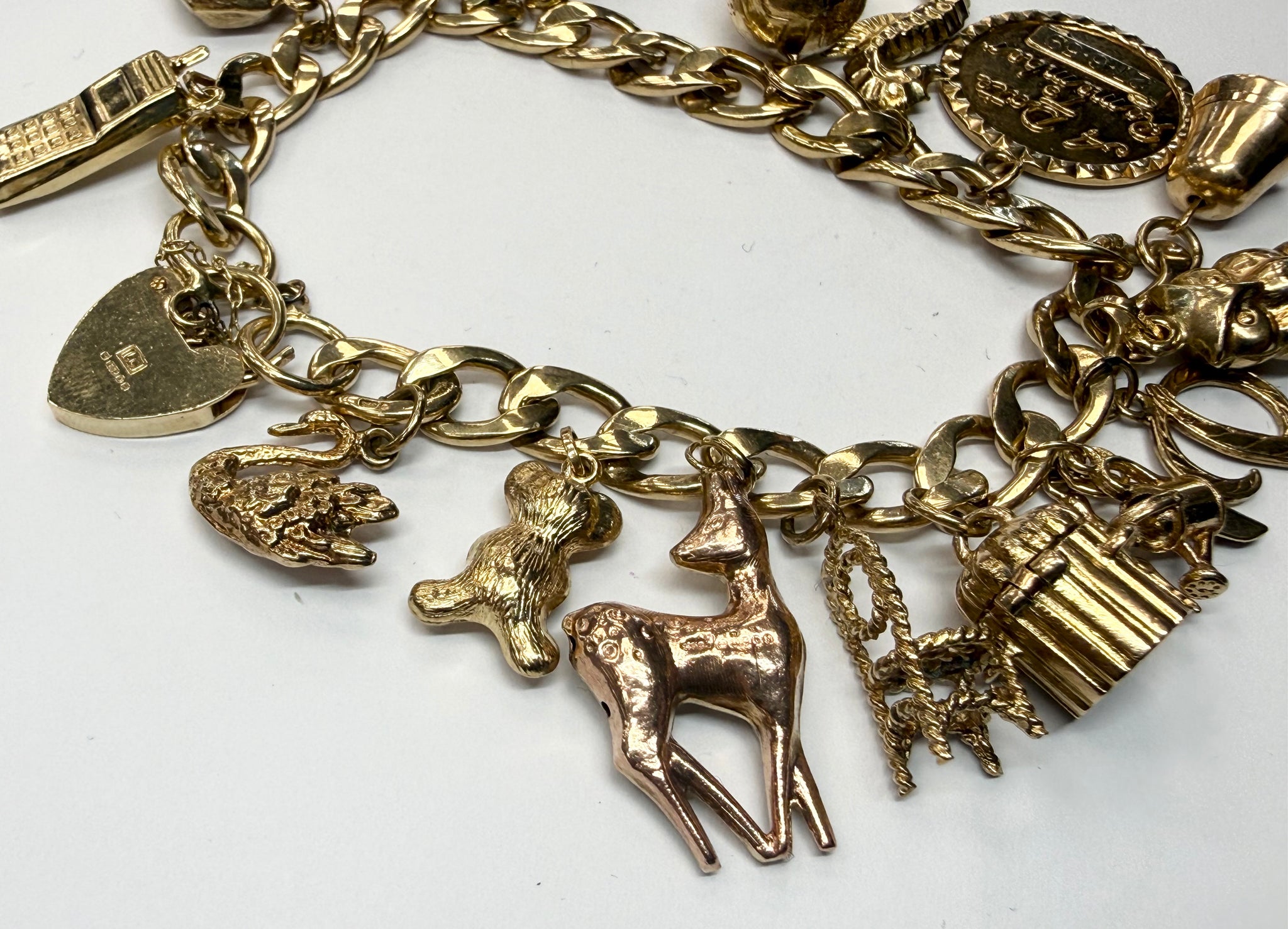 9ct yellow gold charm bracelet with safety chain