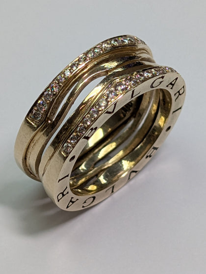 14ct gold diamond twisted puzzle style ring