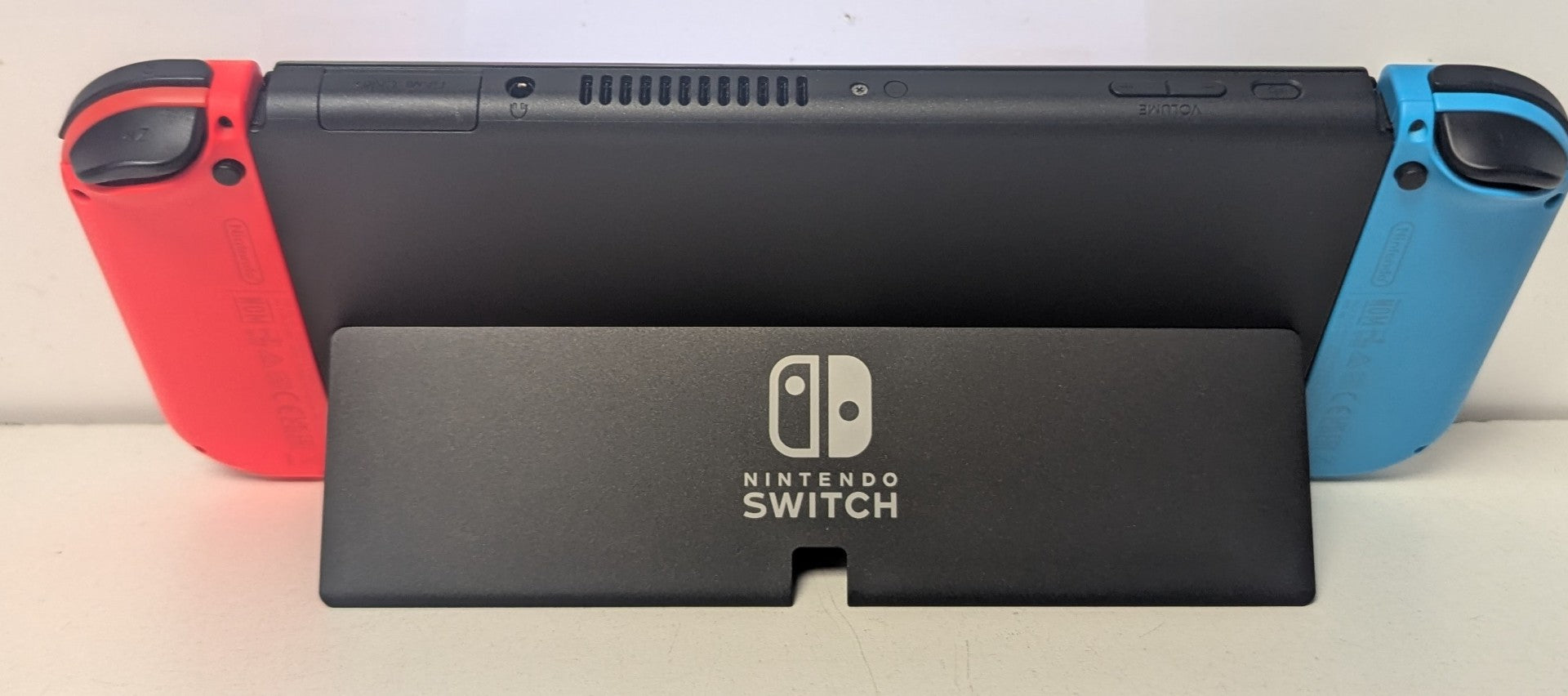 Nintendo Switch OLED - Neon Blue/Neon Red & 2 Games