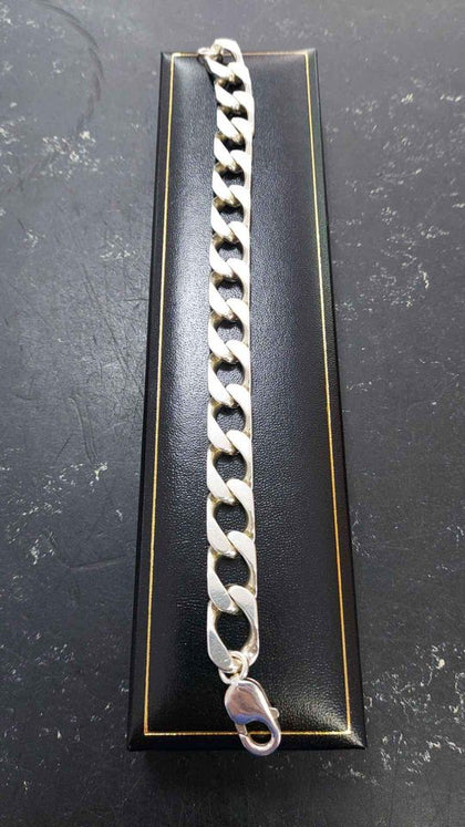 Silver Curb bracelet weight 53.43, length 8half inch.