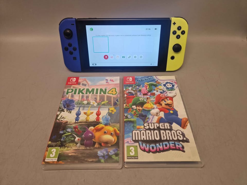 Nintendo Switch Console Bundle. 32gb console with accessories and 2 games, Pikmin 4 and Mario Bros Wonder