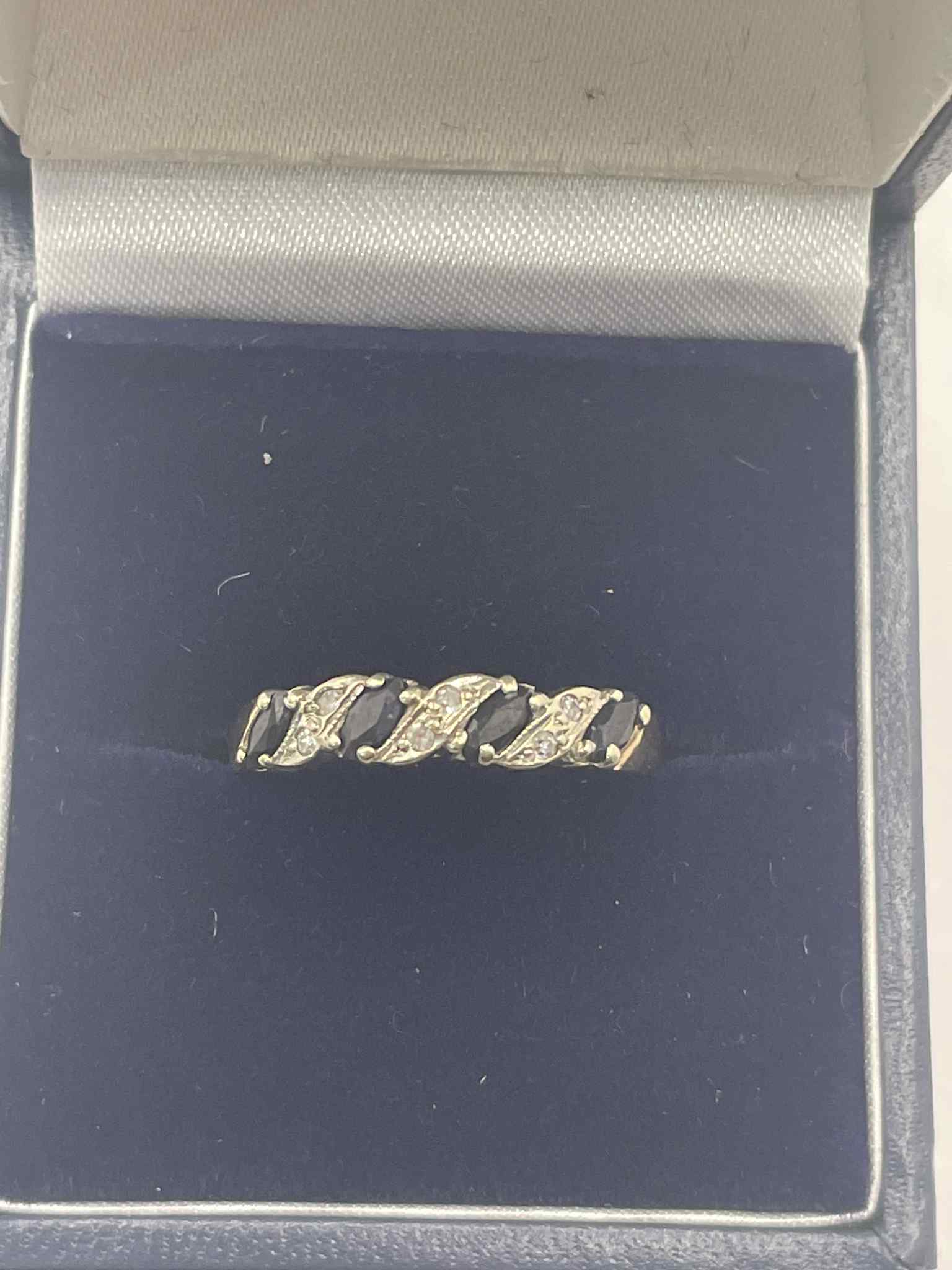 9ct gold ring with clear and black stones