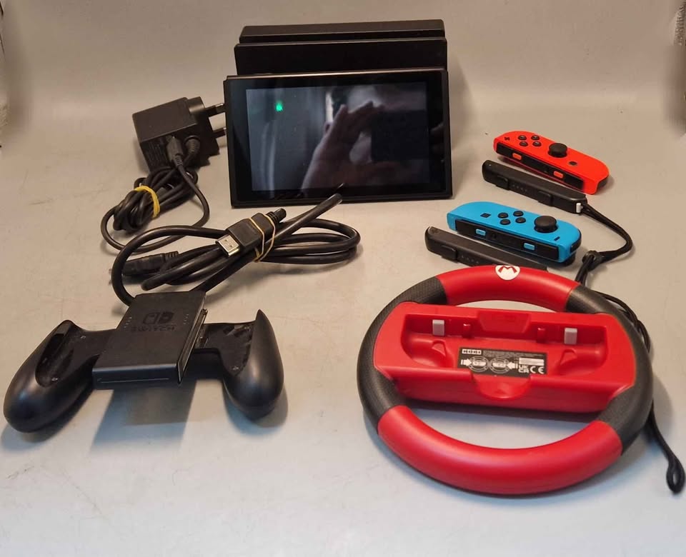 Nintendo Switch Console, 32gb, with wheel and all required cables. Unboxed