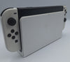 Nintendo Switch OLED 64GB black and white handheld gaming console with dock, charger and joy-con grips unboxed