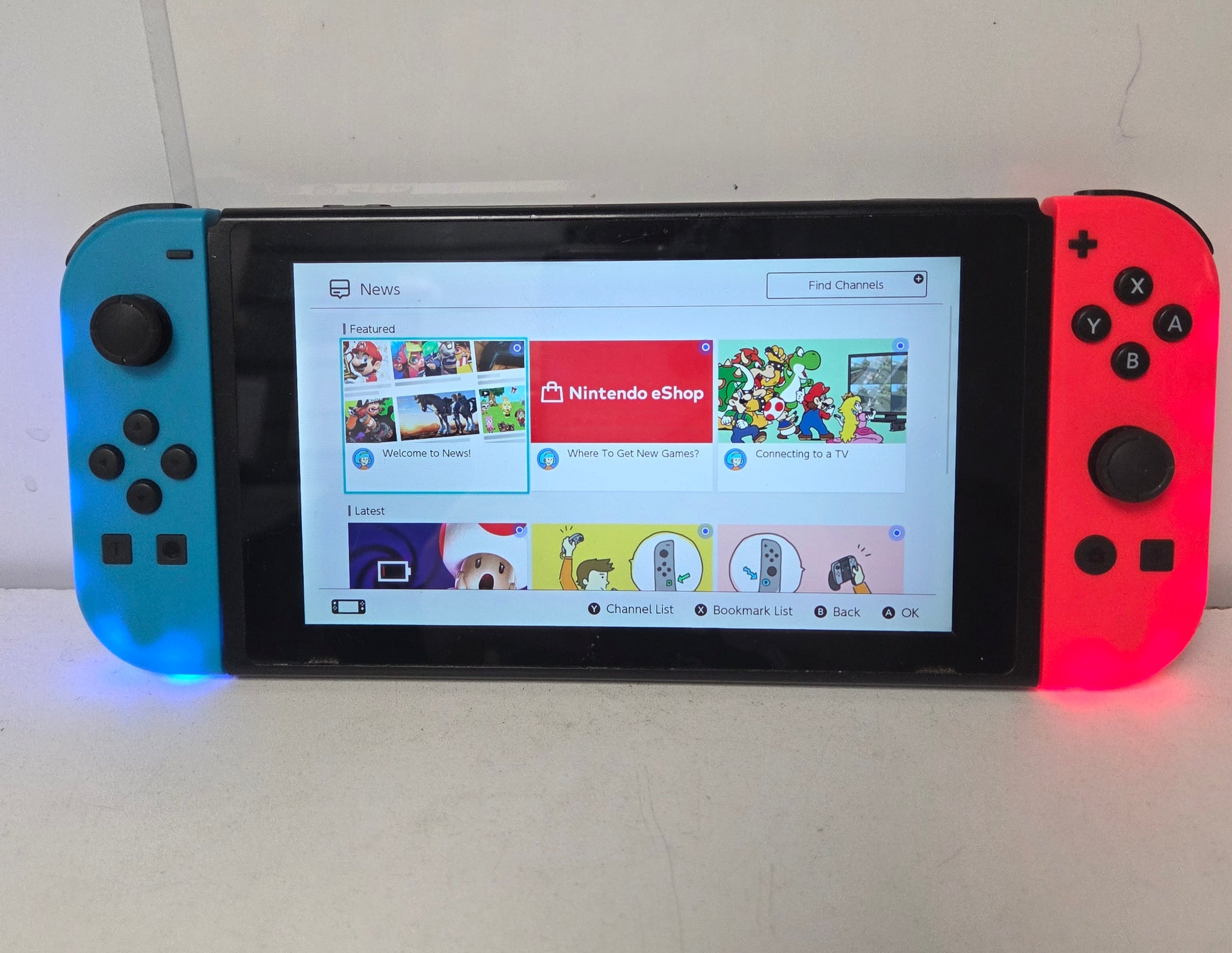 Nintendo Switch (Neon Red/Blue) with 3 unboxed games