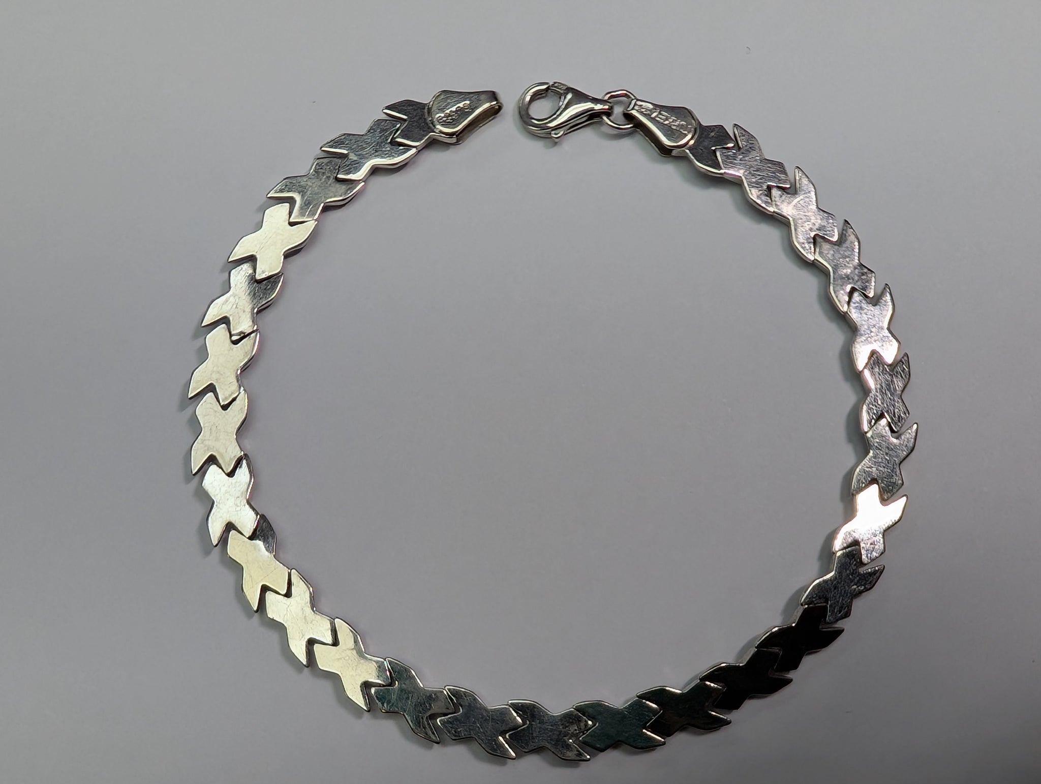 9ct white gold flat x bracelet