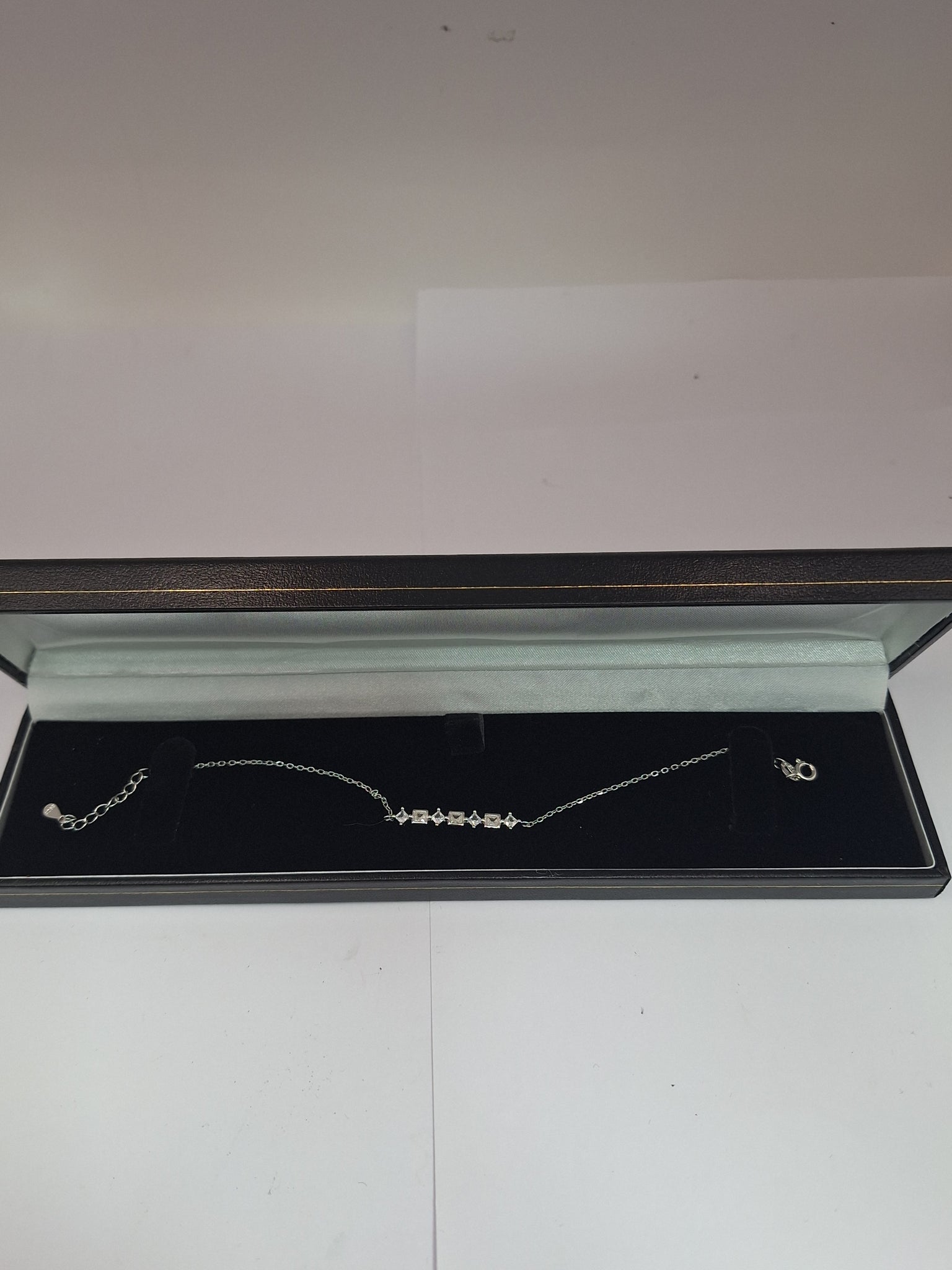 NEW OTHER SILVER BRACELET WITH STAR AND SQUARE ,CZ ,925, LENGHT 8"  WEIGHT 1.9G .