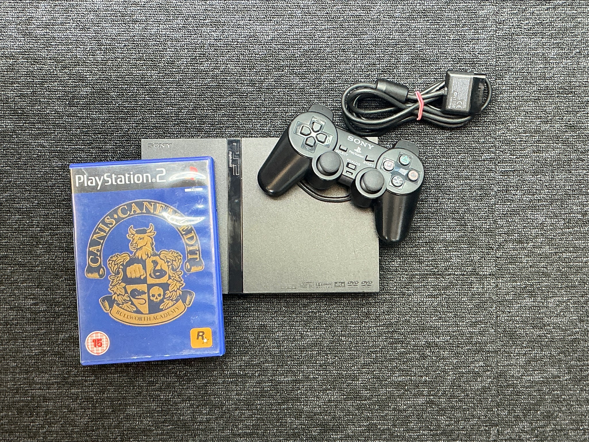 PlayStation 2 Slimline Console + Canis Canem Edit game