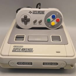 Super Nintendo Entertainment System 2 controllers and Leads (Some Case Damage shown in images)