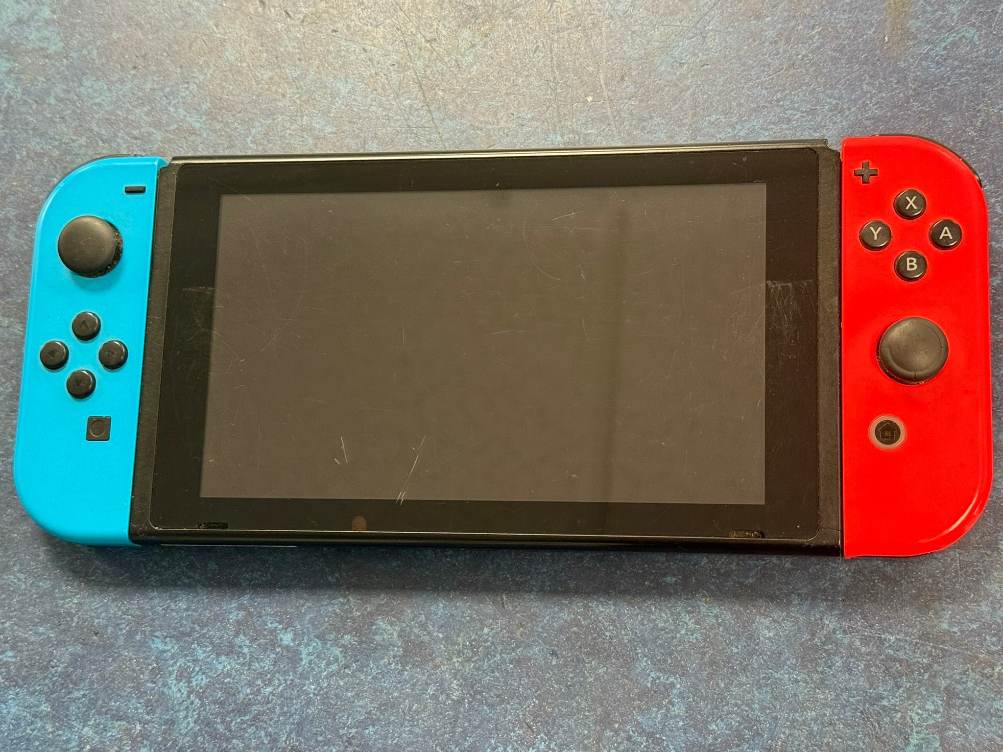 nintendo switch console red and blue joycons