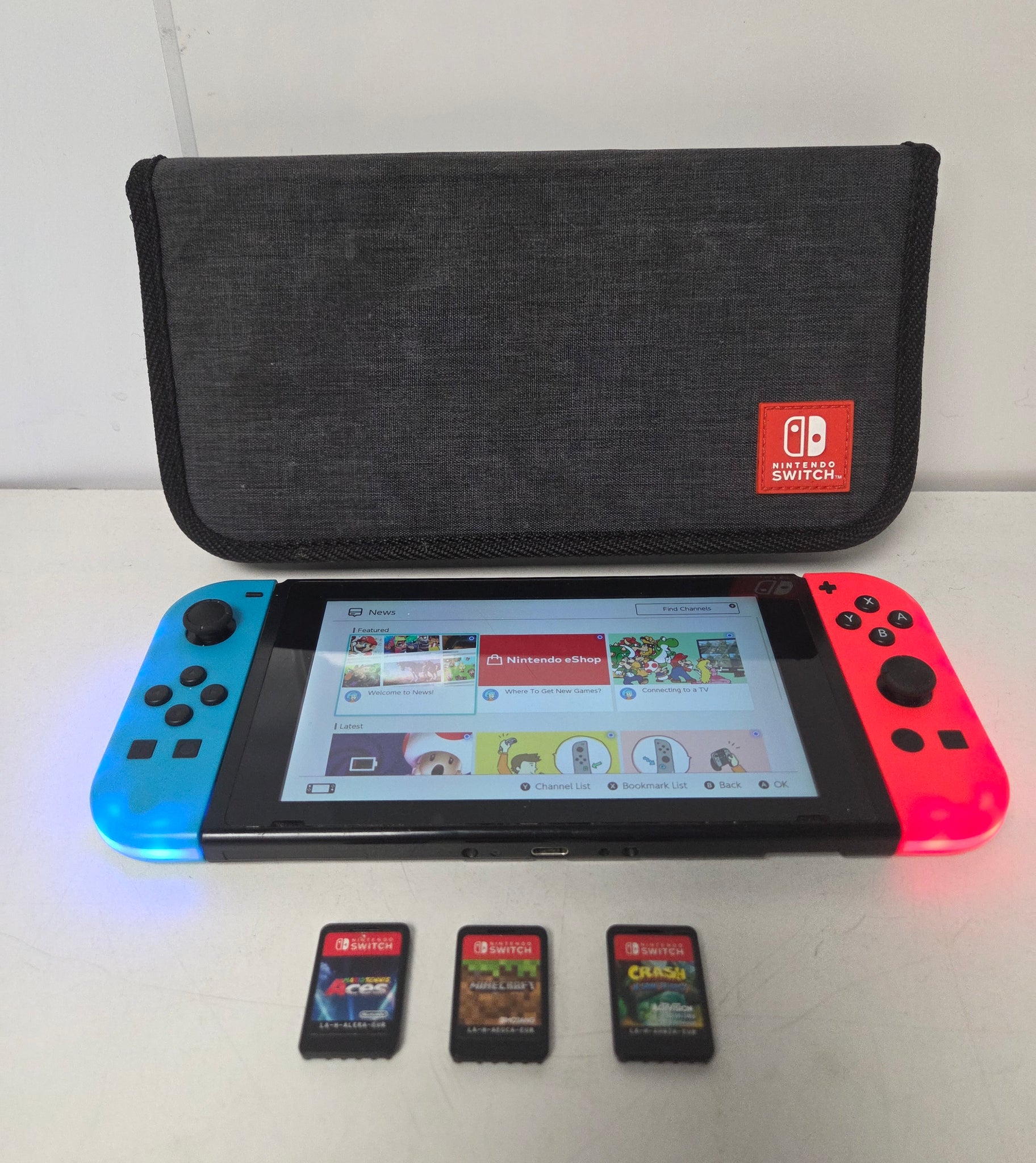 Nintendo Switch (Neon Red/Blue) with 3 unboxed games
