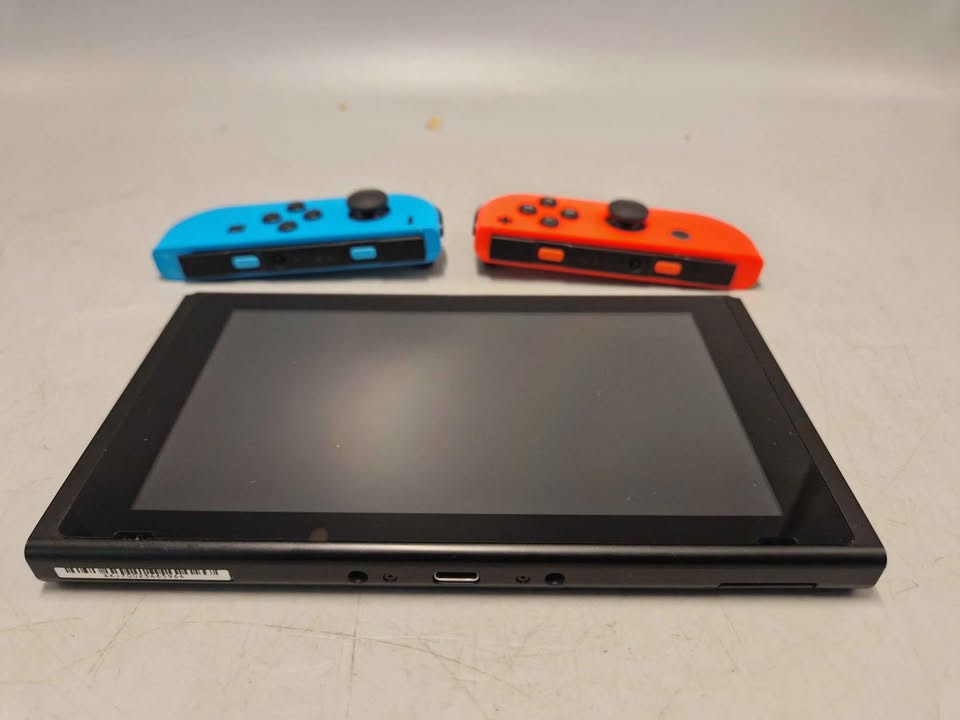 Nintendo Switch Console, 32gb, with wheel and all required cables. Unboxed