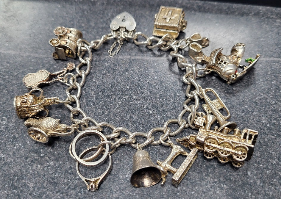 925 - Silver Charm Bracelet - 51.08g