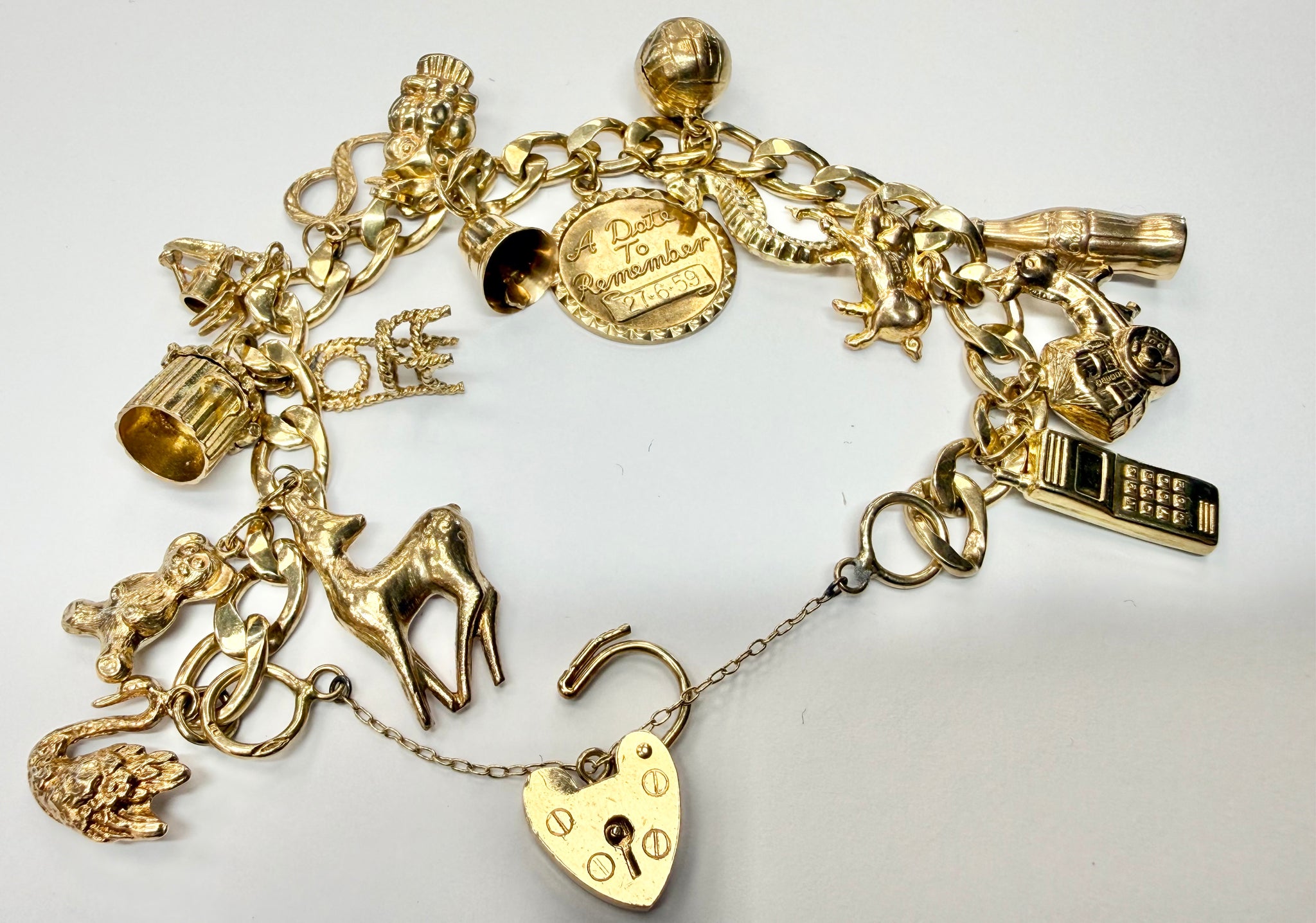 9ct yellow gold charm bracelet with safety chain
