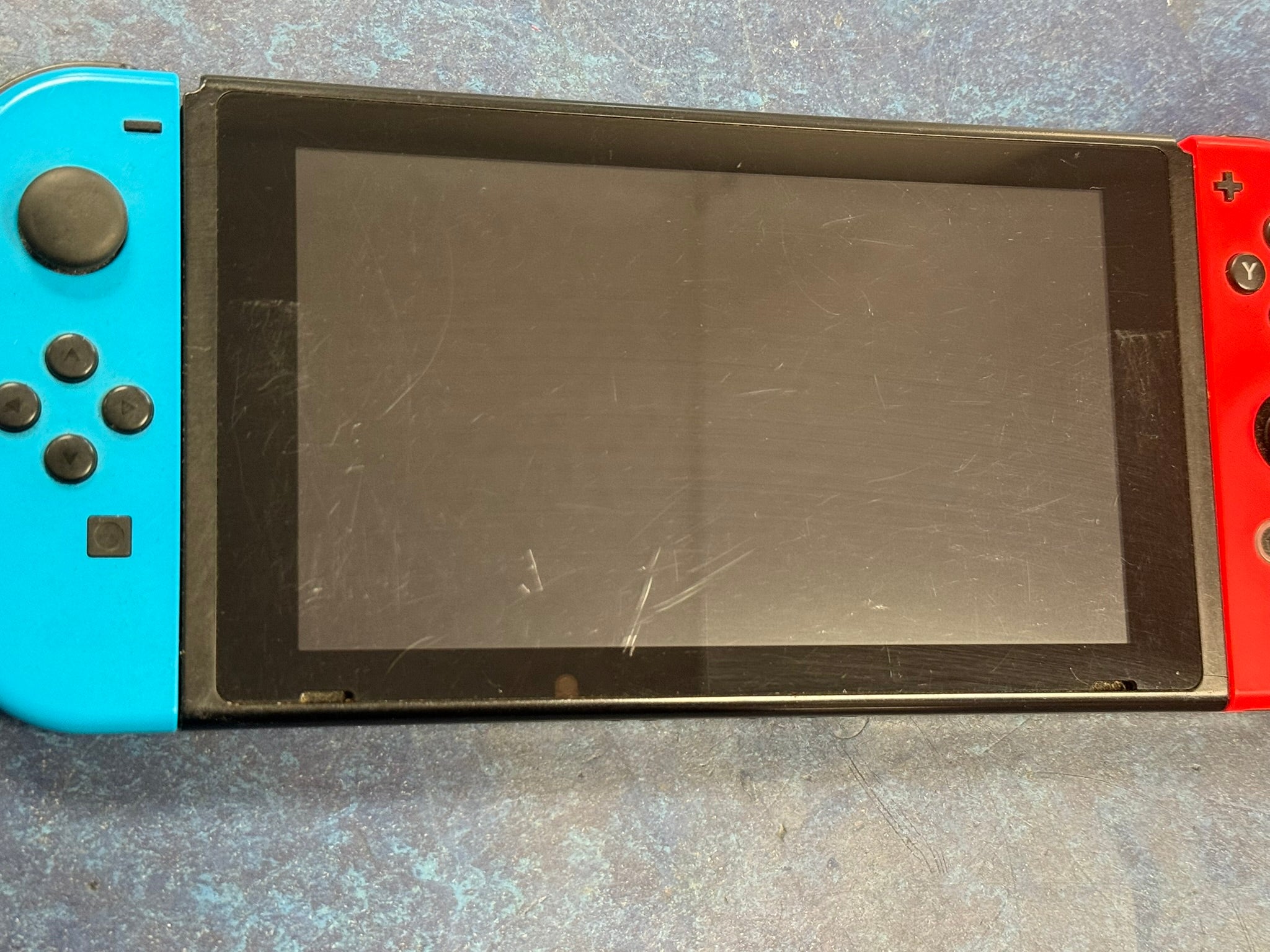 nintendo switch console red and blue joycons