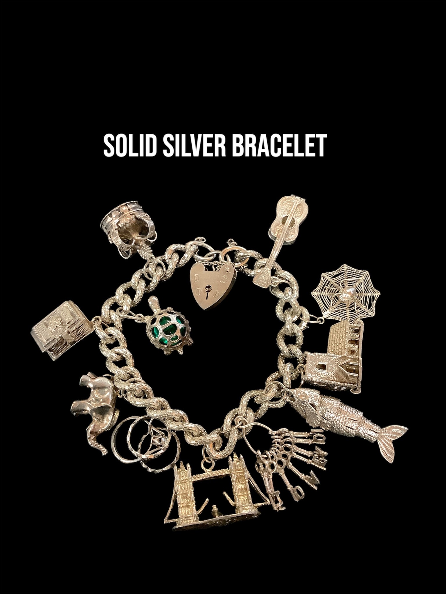 Solid silver charm bracelet with charms 72grams