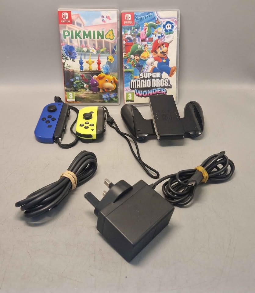 Nintendo Switch Console Bundle. 32gb console with accessories and 2 games, Pikmin 4 and Mario Bros Wonder