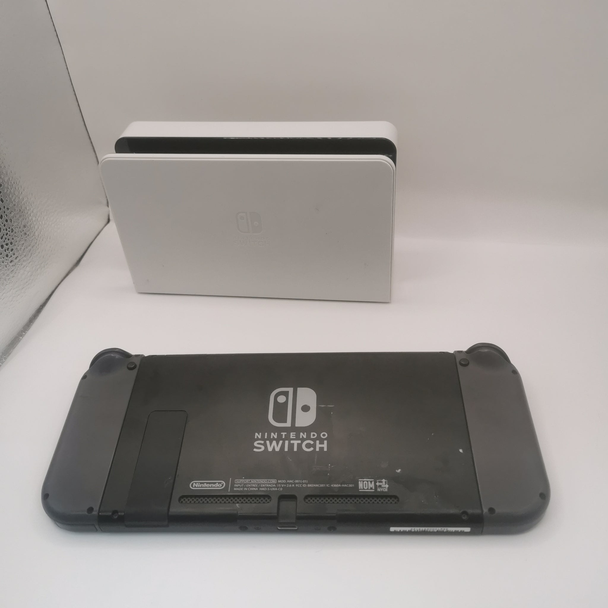 Nintendo Switch Console Hac-001(-01) 32gb Video Gaming Handheld with 2 grey joycons and a dock with chzarger included  item is unboxed