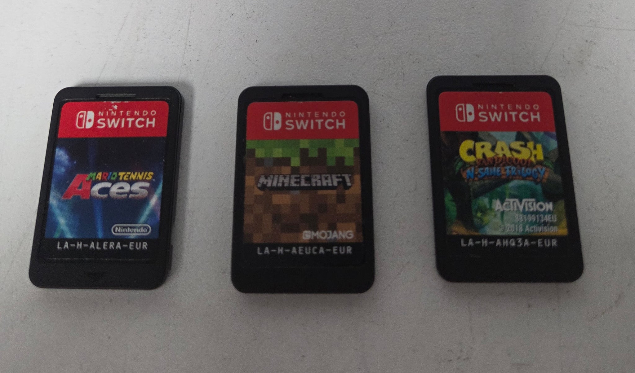 Nintendo Switch (Neon Red/Blue) with 3 unboxed games