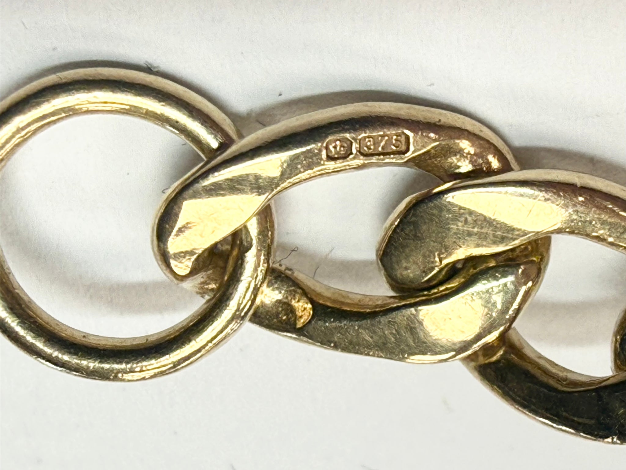 9ct yellow gold charm bracelet with safety chain