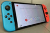 **Sale** Nintendo Switch - OLED Model - Neon Blue/Neon Red Boxed