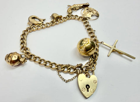 9ct yellow gold charm bracelet with heart shaped padlock clasp and safety chain 8