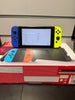 Nintendo Switch Console, 32GB + Blue/Yellow Joy-Con
