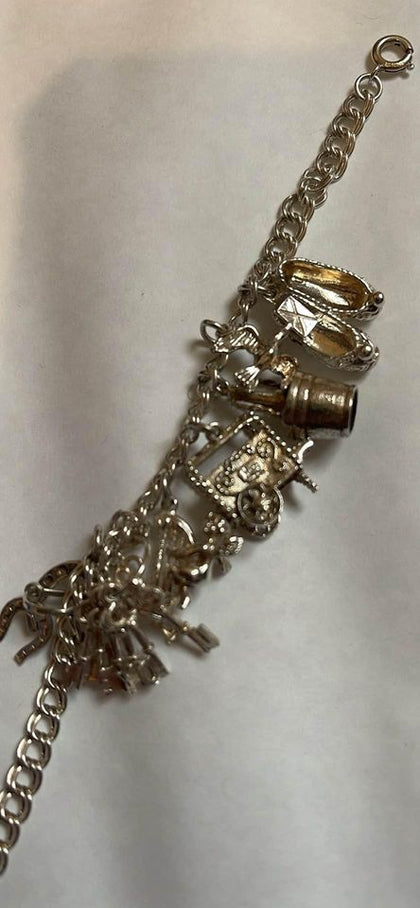 925 Sterling Silver Charm Bracelet - 25.71 Grams - 7” Long.