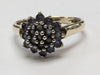 9CT GOLD RING WITH LILAC STONES