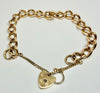 9ct yellow gold curb link bracelet with heart clasp with safety chain 7"