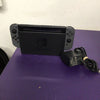 Nintendo Switch with dock and cables.