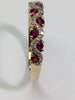 9CT GOLD DIAMOND & RED STONE RING