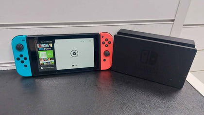 Nintendo Switch console 32GB with neon red & blue joy-con's with dose have scratch on the screen