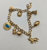 375 9CT HALLMARKED, YELLOW GOLD 8 9CT CHARMS & HEART SHAPED CLASP ON CRUBED CHAIN, 20.2G, 3-7"
