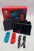 Nintendo Switch 32GB red/blue handheld gaming console with original charger joy-con grips and cradle BOXED