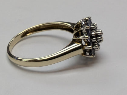 9CT GOLD RING WITH LILAC STONES