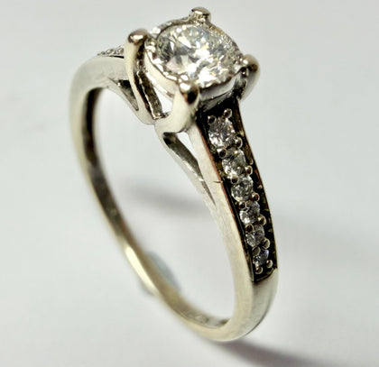 9ct White gold and diamond solitaire size N