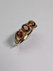 9CT GOLD RING WITH RED STONES SIZE O 1/2