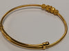 22ct gold baby bangle with patterned rollerball