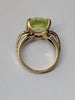 9ct gold ring with large lime green stone size M