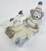 A Lladro Clown 5279, with Concertina and Playing With Puppy.