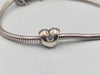 Pandora bracelet with flowered safety chain and heart charm
