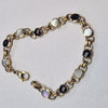 9CT GOLD BRACELET  WITH BLACK/SILVER COLOURED STONE PRESTON STORE