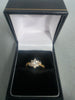 18ct GOLD RING WITH WHITE STONES 2.2G 750 Size L