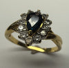 18CT GOLD RING WITH DIAMOND AND SAPPHIRE SIZE O