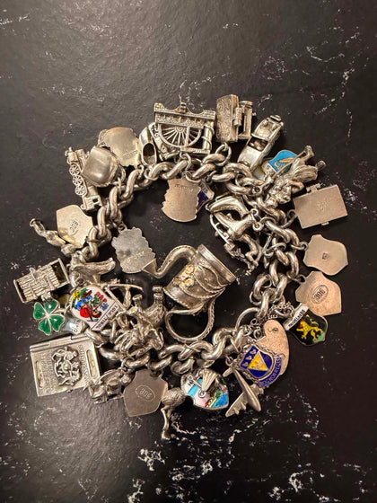 Silver vintage charm bracelet 117g with 30 plus charms