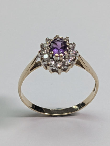 9ct gold ring with purple centre stone